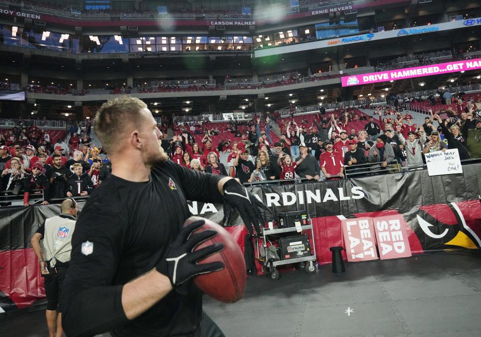 Dec 13, 2021; Glendale, Arizona, USA; Arizona Cardinals defensive end J.J. Watt plays catch with fans before Monday Night Football game against the Los Angeles Rams at State Farm Stadium. Mandatory Credit: Michael Chow-Arizona Republic