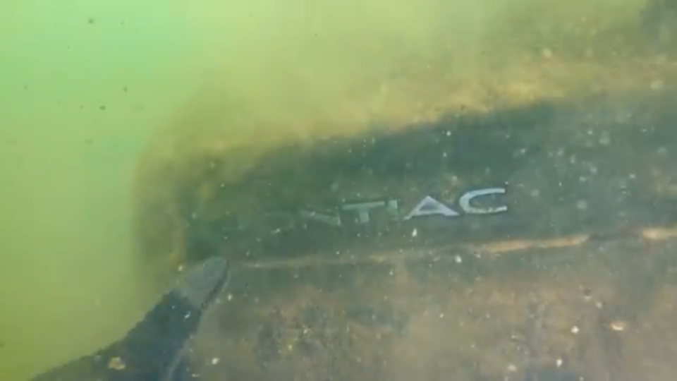 Mr Sides captured the underwater moment he discovered the Pontiac in which the Tennessee teens had last been spotted in 21 years ago (YouTube/Exploring With Nug)