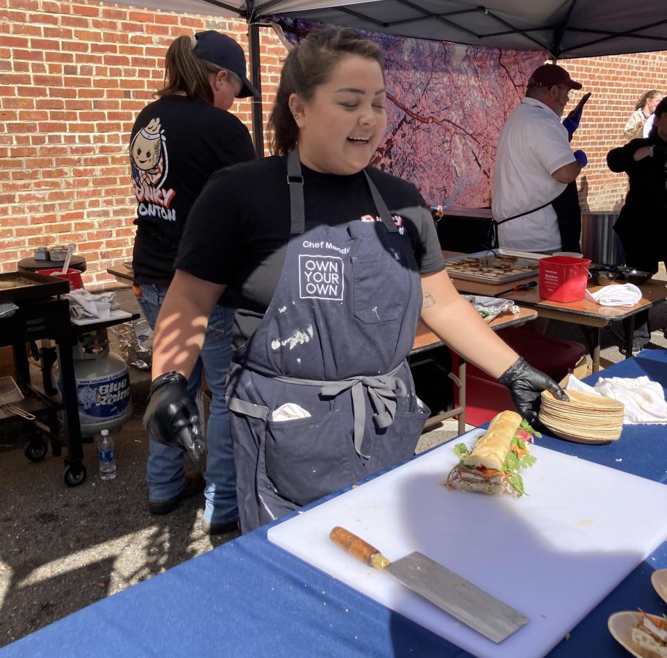 Chef Mandy Chow of Wilmington was one of 12 chefs to advance in the Own Your Own Competition, which will award the winner their own Burgaw restaurant. She prepared sample of her The Crouching Chicken sandwich for judges at the Town Square Cook-off on Oct. 21, 2023.
