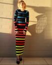 <p>in a rainbow stripe Christopher John Rogers dress, Mejuri jewelry and Tamara Mellon heels. </p>