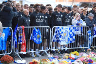 <p>Leicester City Youth Team Coach Steve Beaglehole (left) and members of the Leicester City Youth Team pay tribute at Leicester City Football Club. Mike Egerton/PA Wire/PA Images </p>