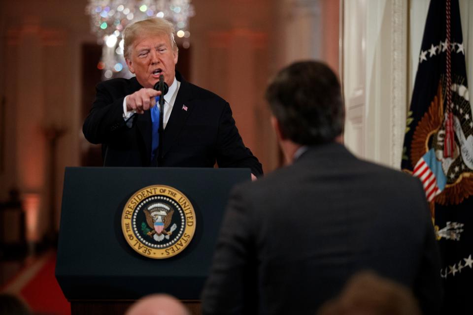 President Donald Trump faces off with CNN's Jim Acosta during a White House news conference in 2018.