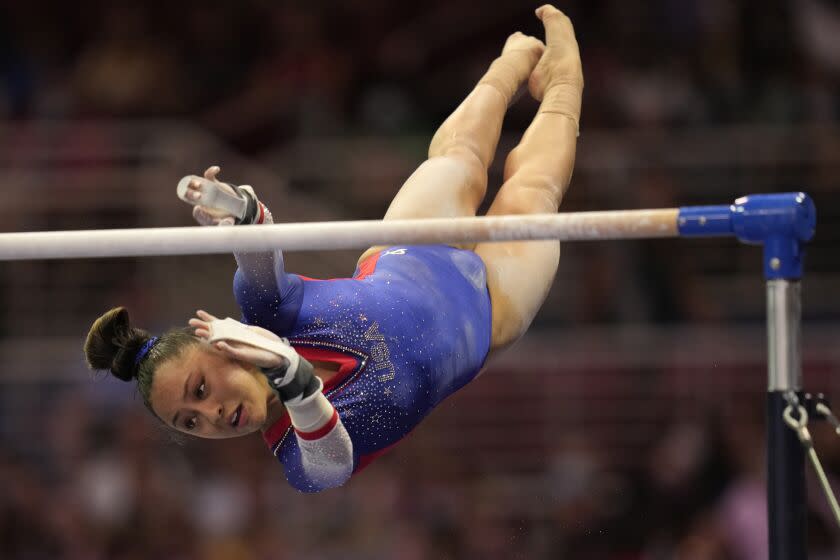 Emma Malabuyo competes on the uneven bars during the women's U.S. Olympic Gymnastics Trials.