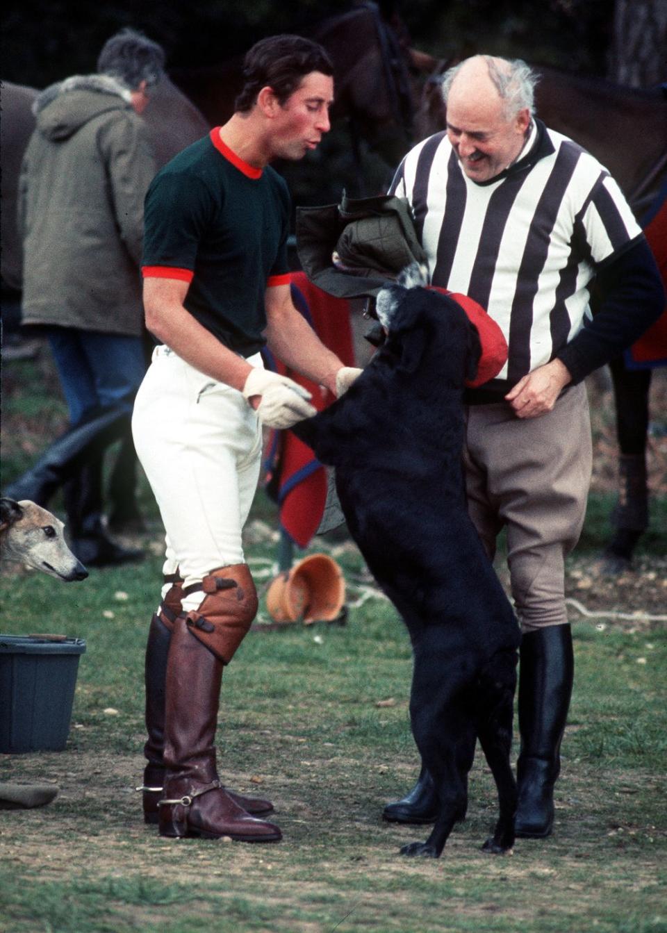 <p>Prince Charles bonds with a new four-legged friend during a polo match at the Guards Polo Ground.</p>