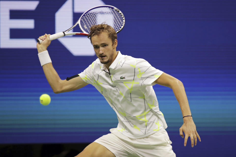 Daniil Medvedev, of Russia, returns a shot to Grigor Dimitrov, of Bulgaria, during the men's singles semifinals of the U.S. Open tennis championships Friday, Sept. 6, 2019, in New York. (AP Photo/Charles Krupa)