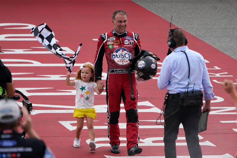 Kevin Harvick's daughter, Piper, collected the checkered flag after dad's win Sunday at Michigan.