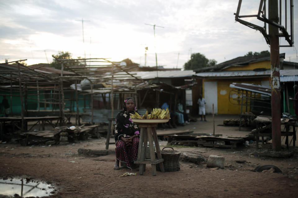 FILE-A Liberian woman sells bananas on the side of the road in Monrovia, Liberia, Sept. 28, 2014. Liberia has been celebrating two major developments in 2022, the 200 year anniversary of its birth when freed slaves founded the West African nation, and then 25 years later declared its independence in July 1847. Over the years, Washington has not been so complimentary about Liberia's stance against corruption, which many say is largely responsible for the underdevelopment and poor economic growth of an otherwise resourceful country of less than 6 million people.(AP Photo/Jerome Delay, File)