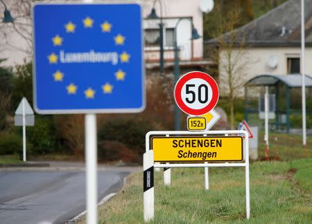 A street sign marks the beginning of Schengen, Luxembourg January 27, 2016. The Schengen Agreement with the goal to illiminate internal border controls was signed on June 14, 1985 in the small village at the river Moselle and the tripoint of France, Germany and Luxembourg between the five countries of Belgium, France, Germany, Luxembourg and netherlands. REUTERS/Wolfgang Rattay