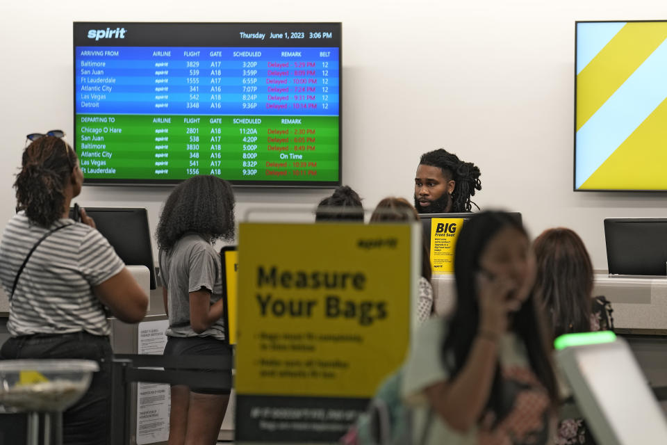 Passengers wait in a line for help at the Spirit Airlines ticket counter at the Tampa International Airport Thursday, June 1, 2023, in Tampa, Fla. Spirit Airlines and Air Canada have delays due to technical problems. (AP Photo/Chris O'Meara)