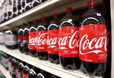 Bottles of Coca Cola are seen in a store display in New York in this February 9, 2010 file photo. REUTERS/Lucas Jackson/Files