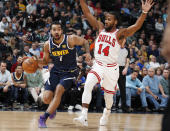 Denver Nuggets forward Trey Lyles, left, drives past Chicago Bulls forward Wayne Selden Jr. in the first half of an NBA basketball game, Thursday, Jan. 17, 2019, in Denver. (AP Photo/David Zalubowski)