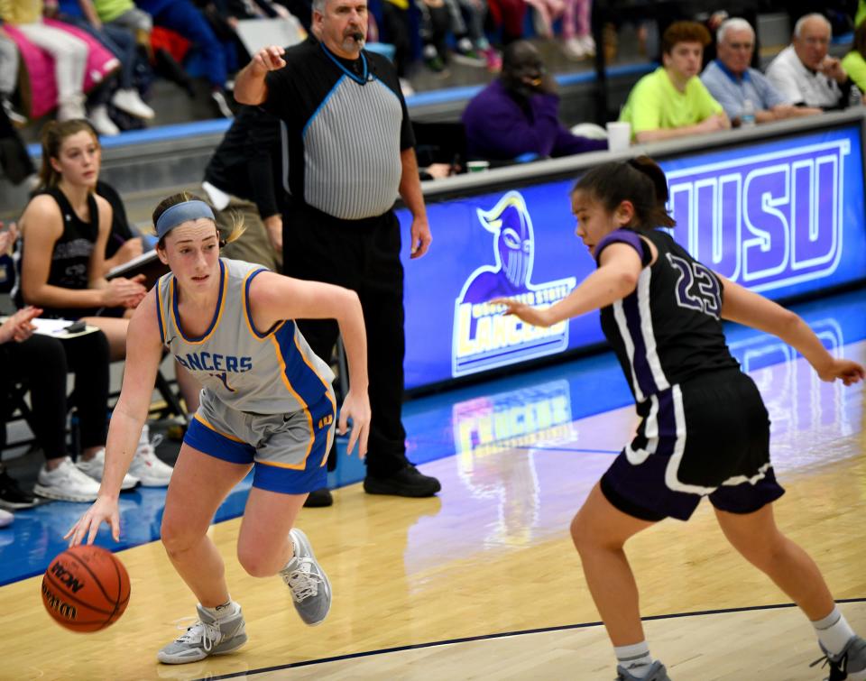 Erin Gallella looks for an opening as the Worcester State University women's basketball team hosted Amherst in their annual Math Madness game.