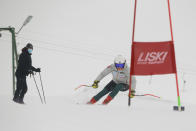 Kiana Kryeziu speeds down the course during training at the Arxhena Ski center in Dragas, Kosovo on Saturday, Jan. 22, 2022. The 17-year-old Kryeziu is the first female athlete from Kosovo at the Olympic Winter Games after she met the required standards, with the last races held in Italy. (AP Photo/Visar Kryeziu)