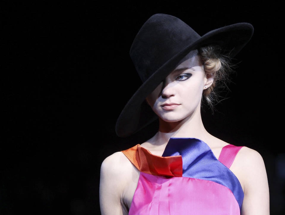 A model wears a creation part of the Giorgio Armani Women's Fall-Winter 2012-13 fashion collection, during the fashion week in Milan, Italy, Monday, Feb. 27, 2012. (AP Photo/Antonio Calanni)