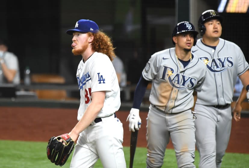 ARLINGTON, TEXAS OCTOBER 21, 2020-Dodgers pitcher Dustin May walks back to the mound after giving up a two-run double to the Rays in the 4th inning in Game 2 of the World Series at Globe Life Field in Arlington, Texas Wednesday. (Wally Skalij/Los Angeles Times)