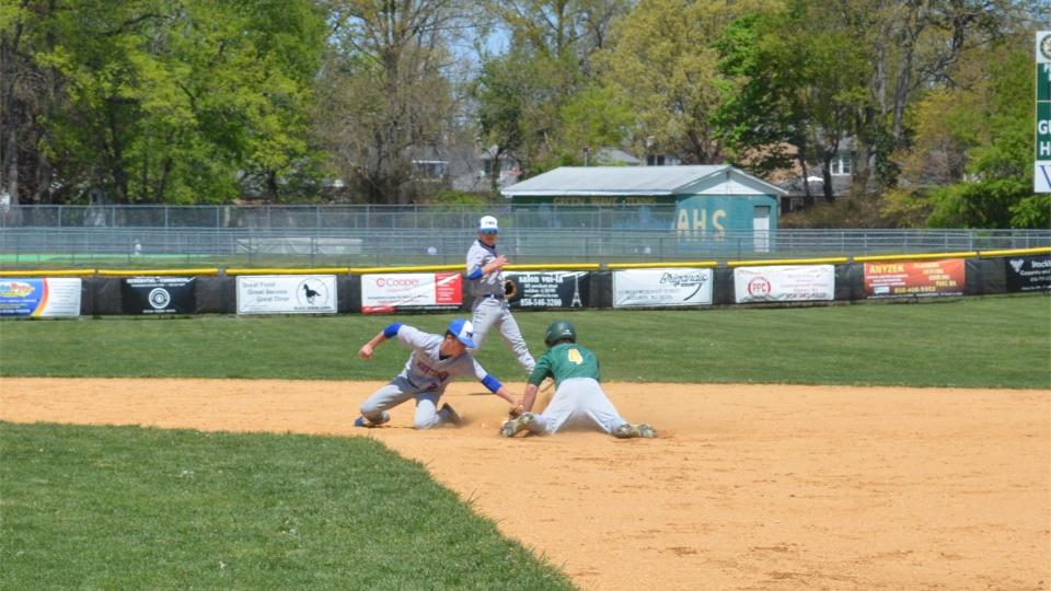 Audubon's Tyler Wiltsee slides safely into second on a stolen base attempt as Washington Township shortstop Chris Smith applies a late tag during their Thank You Classic meeting at Audubon on Saturday, April 30, 2022.