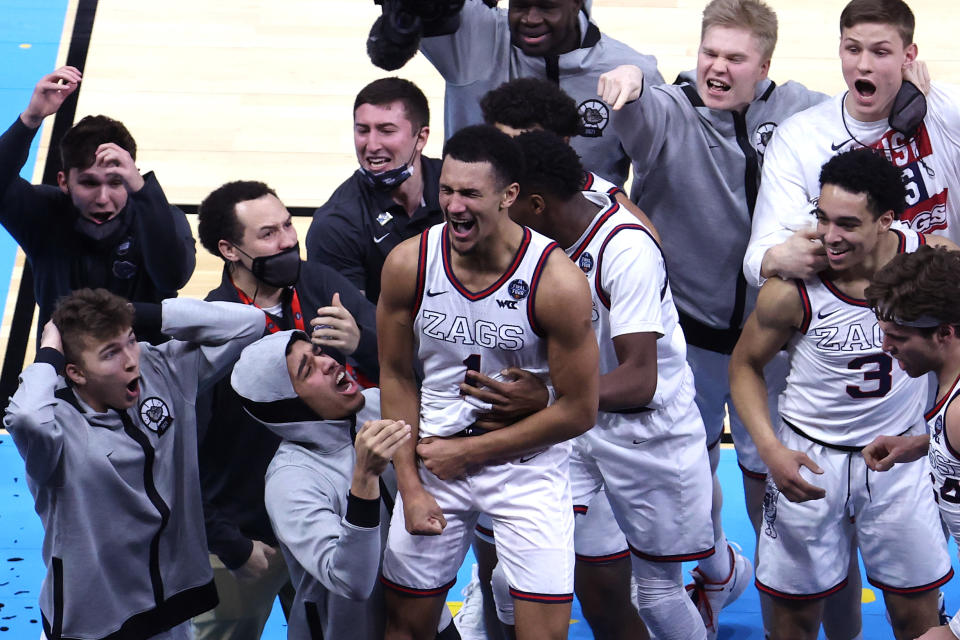 INDIANAPOLIS, INDIANA - APRIL 03: Jalen Suggs #1 of the Gonzaga Bulldogs celebrates with teammates after making a game-winning three point basket in overtime to defeat the UCLA Bruins 93-90 during the 2021 NCAA Final Four semifinal at Lucas Oil Stadium on April 03, 2021 in Indianapolis, Indiana. (Photo by Andy Lyons/Getty Images)