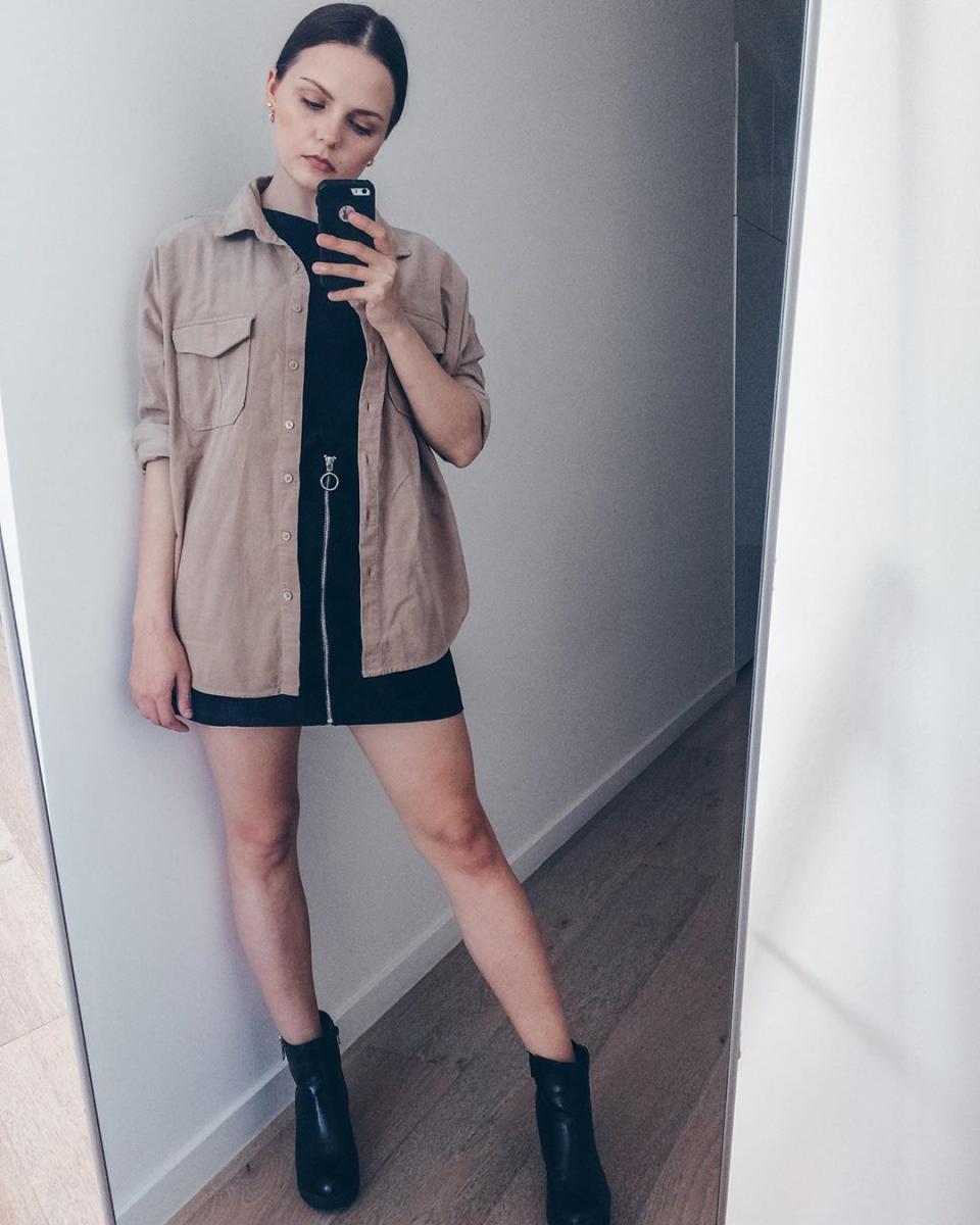 The beige shirt is a stlish way to break up an all-black outfit. Photo: Instagram/thebudgetsavvygirl.