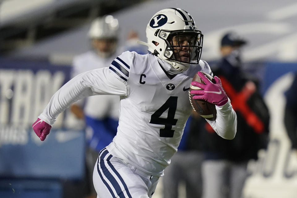 BYU running back Lopini Katoa (4) carries the ball for a touchdown against Western Kentucky during the first half of an NCAA college football game Saturday, Oct. 31, 2020, in Provo, Utah. (AP Photo/Rick Bowmer, Pool)
