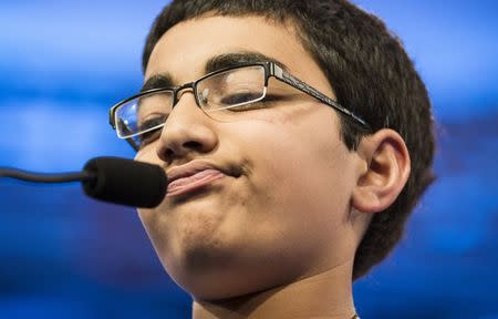 Siddharth Krishnakumar of Houston, Texas, fails to spell "minhag" during the final round of the 88th annual Scripps National Spelling Bee at National Harbor, Maryland May 28, 2015. REUTERS/Joshua Roberts