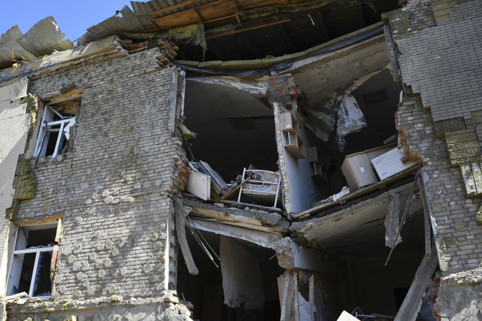 A baby bed is seen inside an apartment building damaged by Russian shelling in Bakhmut, Donetsk region, Ukraine, Thursday, May 12, 2022. (AP Photo/Andriy Andriyenko)