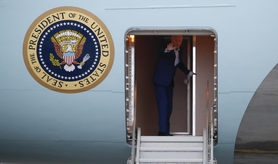 U.S. President Joe Biden waves as he boards Air Force One to return to Washington after attending the G20 Leaders' summit in Bali, Indonesia, Wednesday Nov. 16, 2022. (Ajeng Dinar Ulfiana/Pool Photo via AP)