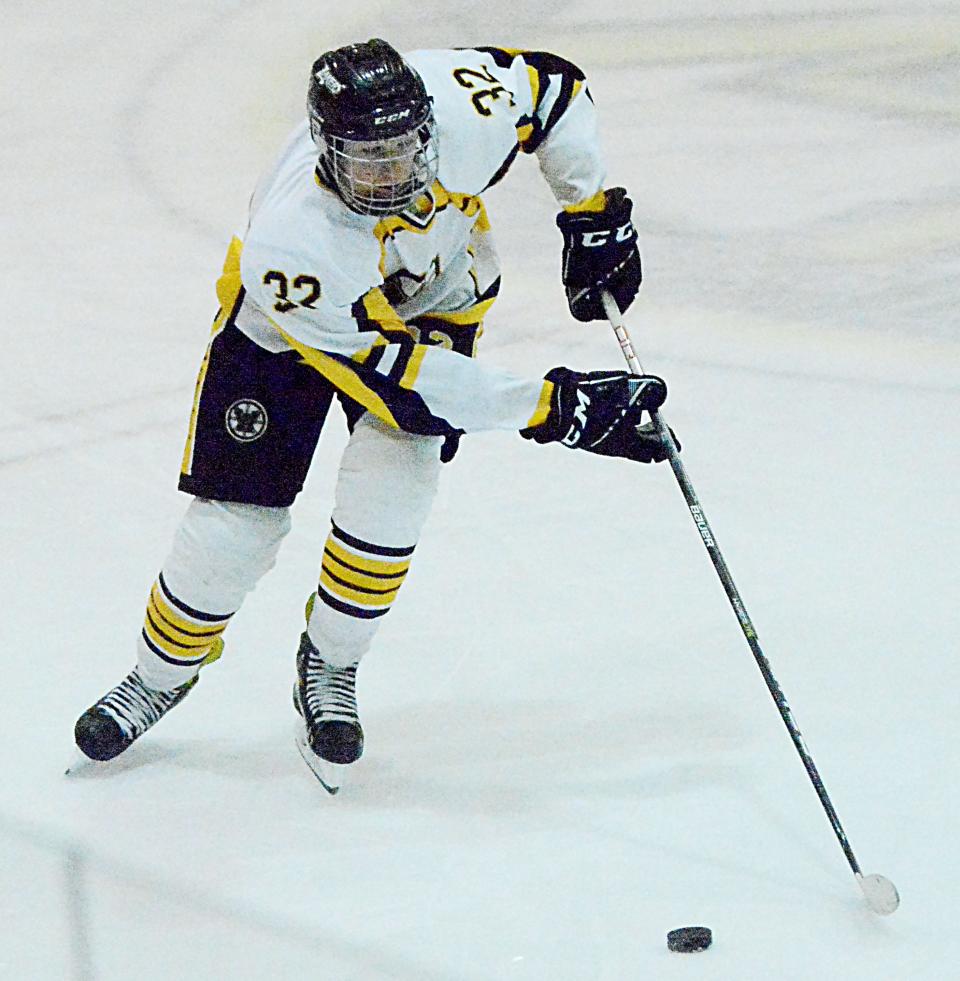 Ethan Skott of the Watertown Lakers advances the puck Thursday during s South Dakota Amateur Hockey Association varsity boys' game against Brookings in the Maas Ice Arena. Brookings won 8-0.