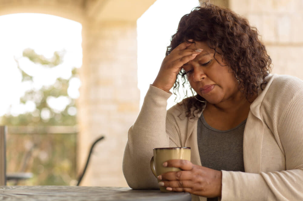 Woman experiencing headache symptoms