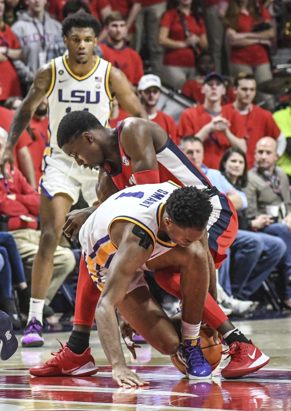 LSU guard Javonte Smart (1) and Mississippi guard Bryce Williams go for the ball during an NCAA college basketball game in Oxford, Miss., Saturday, Jan. 18, 2020. (Bruce Newman/The Oxford Eagle via AP)