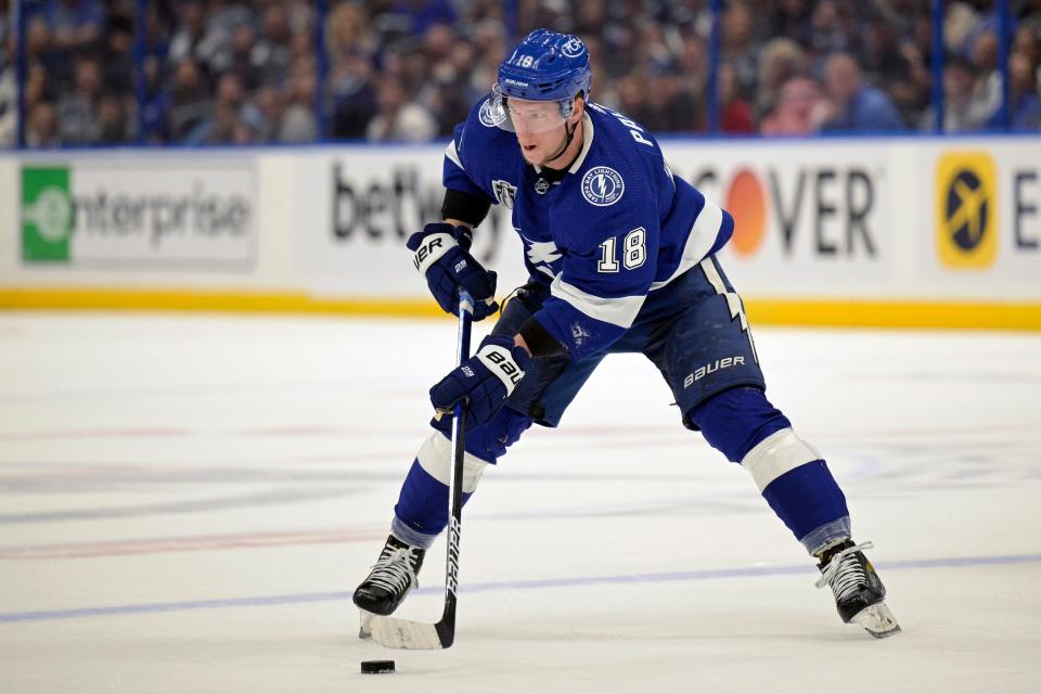 FILE - Tampa Bay Lightning left wing Ondrej Palat (18) controls a puck during the first period of Game 4 of the NHL hockey Stanley Cup Finals against the Colorado Avalanche on June 22, 2022, in Tampa, Fla.  person with knowledge of the situation tells The Associated Press on Thursday, July 14, 2022, that the New Jersey Devils agreed to terms with  Palat on a $30 million, five-year contract. (AP Photo/Phelan M. Ebenhack, File)