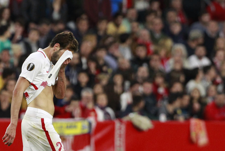 Sevilla's Franco Vazquez leaves the field during the Europa League round of 32 second leg soccer match between Sevilla and Lazio at the Sanchez Pizjuan stadium, in Seville, Spain, Wednesday, Feb. 20, 2019. (AP Photo/Miguel Morenatti)