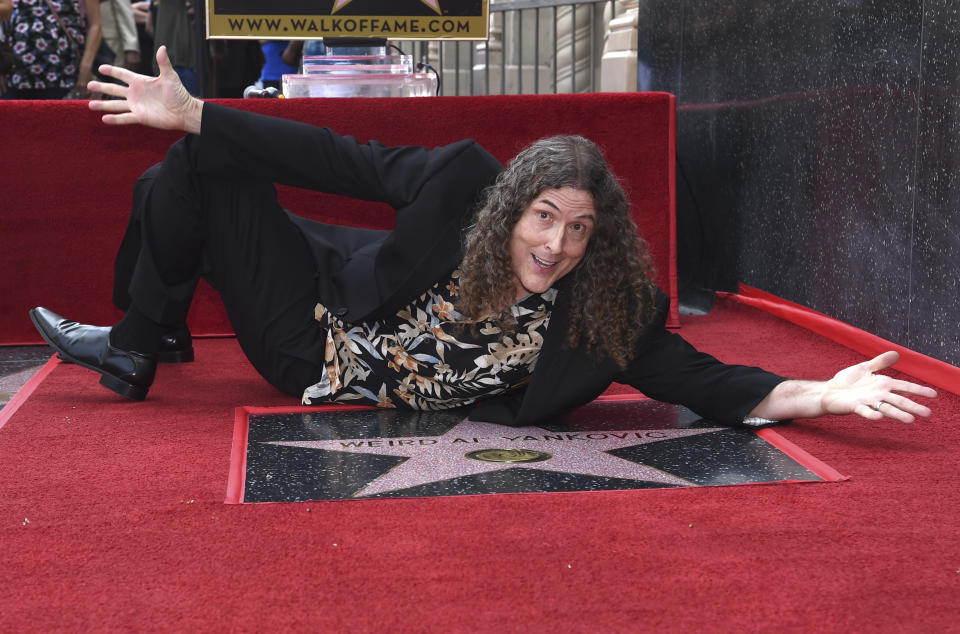 Weird Al Yankovic poses with his star on the Hollywood Walk of Fame. (Photo: AP)