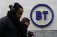 People walk past British Telecom headquarters in London