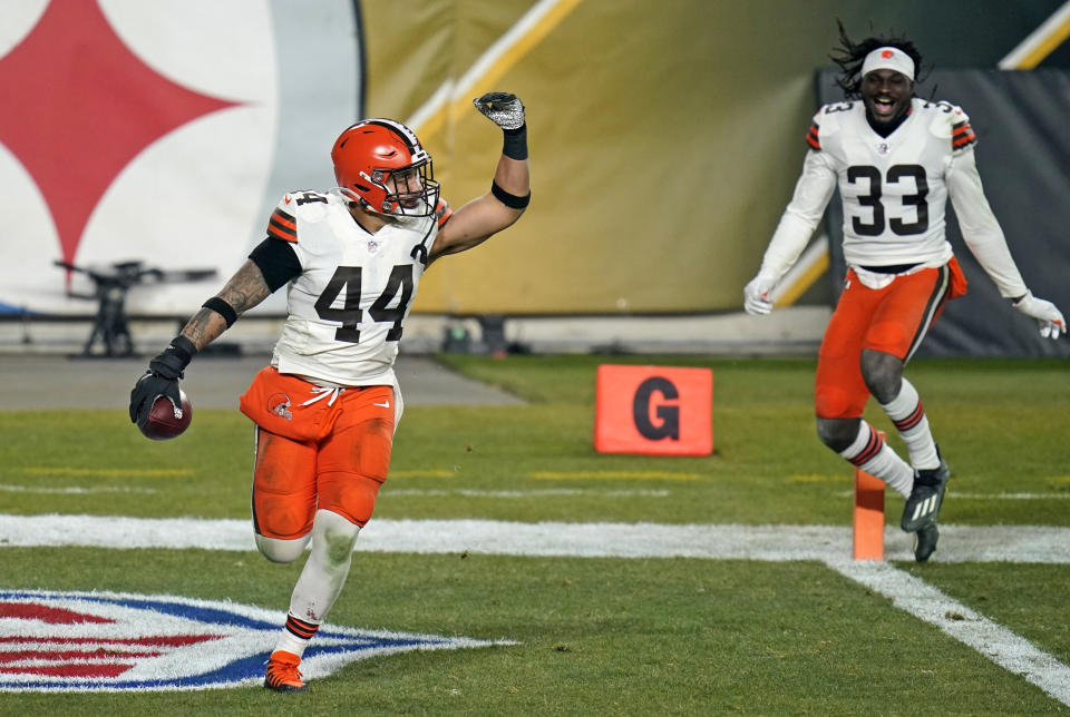 Cleveland Browns outside linebacker Sione Takitaki (44) celebrates after intercepting a pass by Pittsburgh Steelers quarterback Ben Roethlisberger (7) during the second half of an NFL wild-card playoff football game, Sunday, Jan. 10, 2021, in Pittsburgh. (AP Photo/Keith Srakocic)