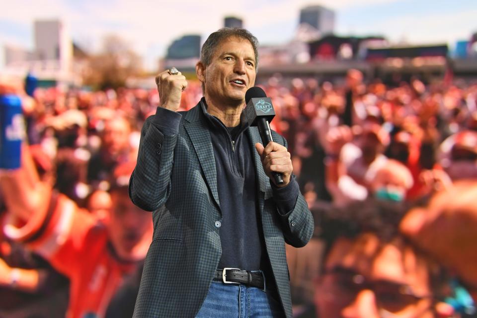 Former Browns quarterback Bernie Kosar speaks to fans during the fourth round of the NFL Draft, May 1, 2021, in Cleveland.