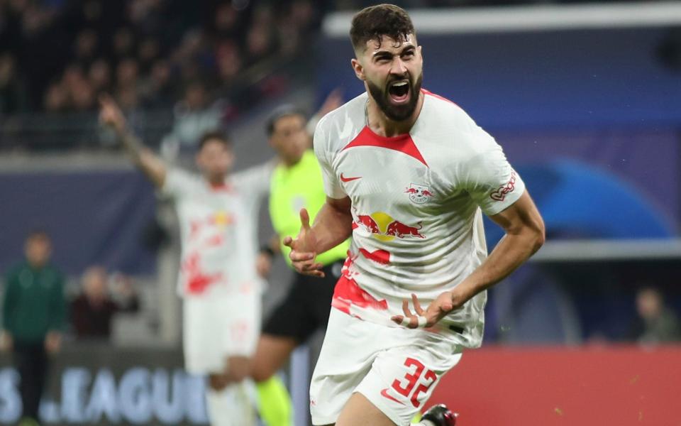 Leipzig's Josko Gvardiol celebrates after scoring his side's opening goal during the UEFA Champions League round of sixteen first leg soccer match - AP/Andreas Gora