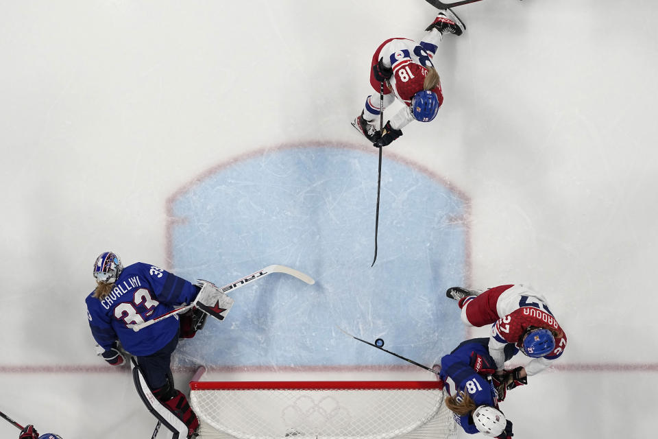 Czech Republic's Michaela Pejzlova (18) scores aa goal during a women's quarterfinal hockey game between USA and Czech Republic at the 2022 Winter Olympics, Friday, Feb. 11, 2022, in Beijing. (AP Photo/Petr David Josek)