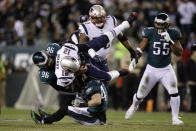 New England Patriots' Tom Brady (12) is tackled by Philadelphia Eagles' Derek Barnett (96) and Nate Gerry (47) during the first half of an NFL football game, Sunday, Nov. 17, 2019, in Philadelphia. (AP Photo/Matt Rourke)