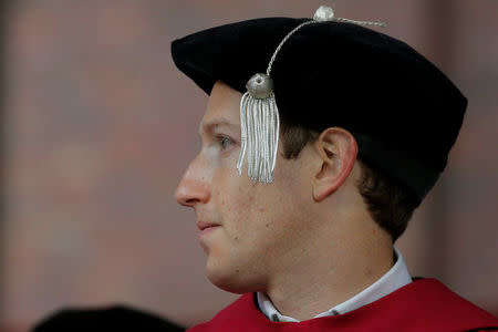 Facebook founder Mark Zuckerberg listens onstage before receiving an honorary Doctor of Laws degree during the 366th Commencement Exercises at Harvard University in Cambridge, Massachusetts, U.S., May 25, 2017. REUTERS/Brian Snyder