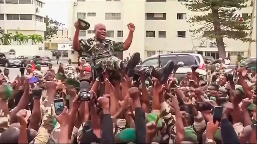 This video grab shows soldiers holding General Brice Clothaire Oligui Nguema aloft in Libreville, Gabon, Wednesday Aug. 30, 2023. (Gabon24 via AP)