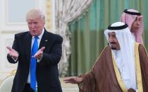 US President Donald Trump and Saudi Arabia's King Salman gesture during a signing ceremony at the Saudi Royal Court in Riyadh on May 20, 2017