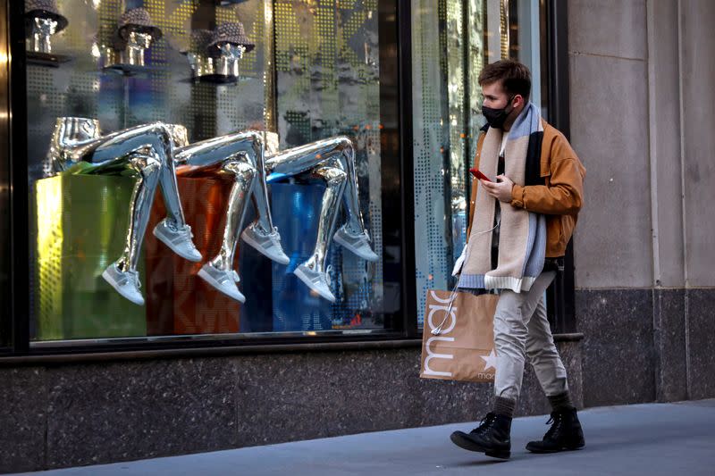 FILE PHOTO: A man shops on 5th Avenue in New York