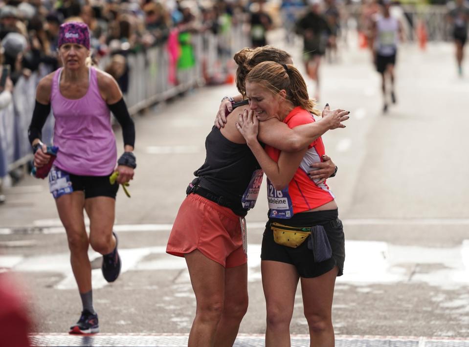 Madeleine Gervason, right, of Cleveland, OH, and Jennifer Forkenbrock of Lawrence, KS hug after finishing the full marathon during the 46th Annual Detroit Free Press Marathon presented by MSU Federal Credit Union in Detroit on Sunday, October 15, 2023.