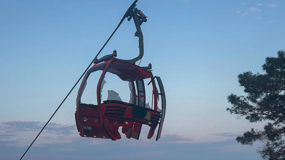 A severely damaged cabin of a cable car