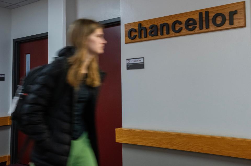 A woman walks past the UW-La Crosse chancellor’s office. Betsy Morgan is leading the university in an interim capacity until a new permanent chancellor is named this spring.