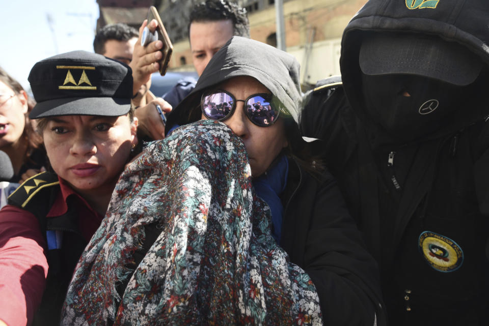 Former first lady and former presidential candidate Sandra Torres is escorted by police to the Supreme Court in Guatemala City, Monday, Sept. 2, 2019. Authorities arrested Torres at her home on charges of campaign finance violations. (AP Photo/Oliver De Ros)