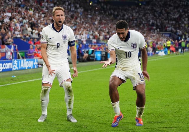 Harry Kane celebrates with Jude Bellingham after scoring England’s second goal against Slovakia