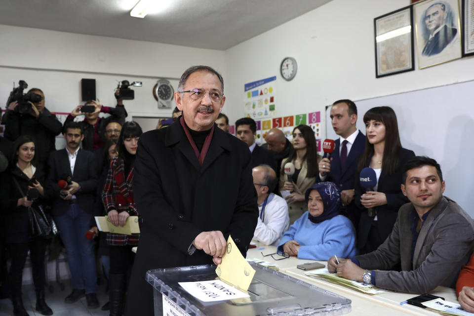 Mehmet Ozhaseki, the mayoral candidate for Ankara of Turkey's ruling Justice and Development Party, AKP and Nationalist Movement Party, MHP, casts his ballot, in Ankara, Turkey, Sunday, March 31, 2019. Turkish citizens have begun casting votes in municipal elections for mayors, local assembly representatives and neighborhood or village administrators that are seen as a barometer of Erdogan's popularity amid a sharp economic downturn. (AP Photo/Ali Unal)