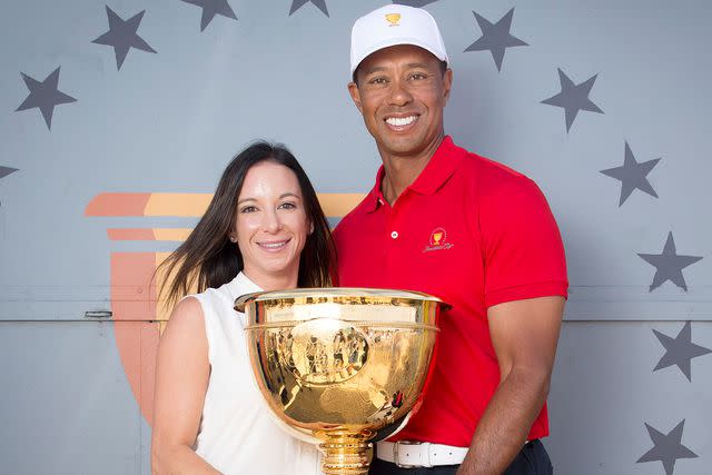 <p>Michael Klein / Newspix / Getty</p> Golfer Tiger Woods with Erica Herman promotes next years Presidents Cup at Eureka Tower in Melbourne, Victoria