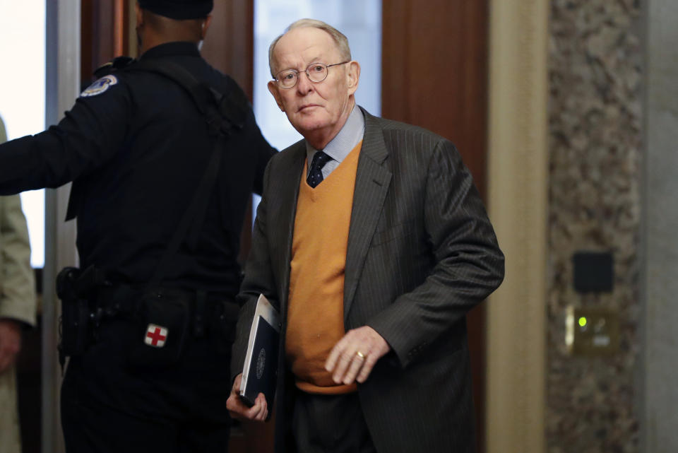 Sen. Lamar Alexander, R-Tenn., arrives at the Capitol in Washington during the impeachment trial of President Donald Trump on charges of abuse of power and obstruction of Congress, Friday, Jan. 24, 2020. (AP Photo/Julio Cortez)